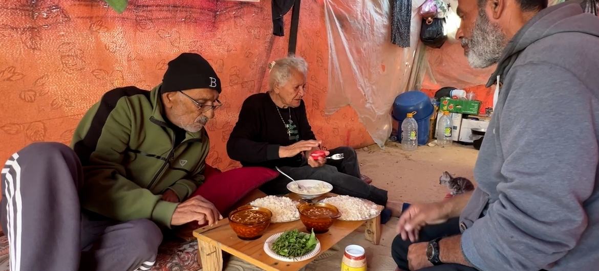 Uncle Tony with his wife, Amal, and their neighbour, Hossam, having dinner together