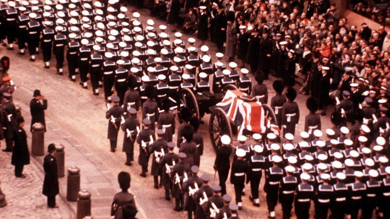 Royal Navy officers and men escort a gun carriage with the flag-draped coffin of Britain's wartime leader, Sir Winston Churchill, from St. Paul's Cathedral, London, Jan. 30, 1965. (AP Photo)