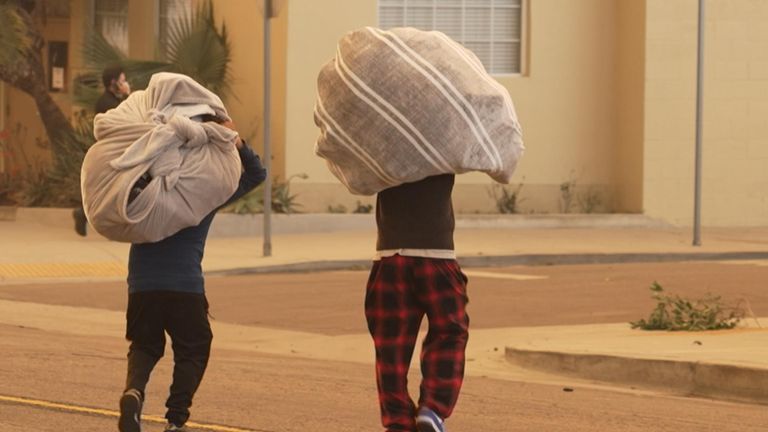 People carried as much as they could in blankets on their backs