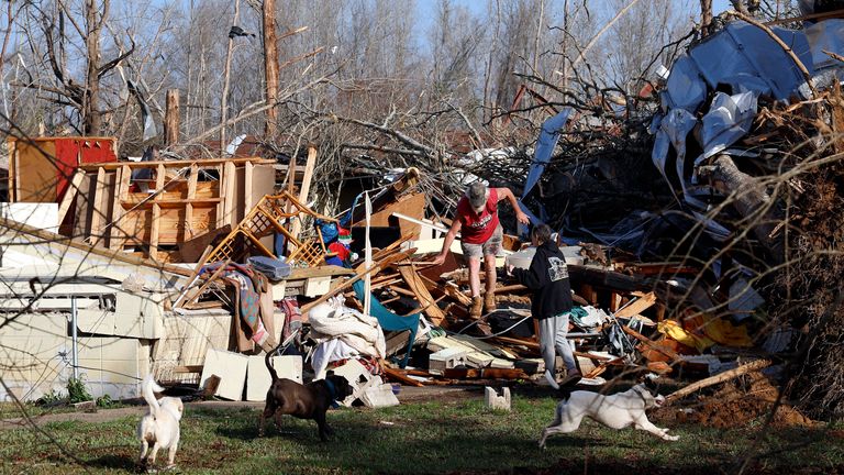 Residents search the wreckage in Alabama. Pic: AP